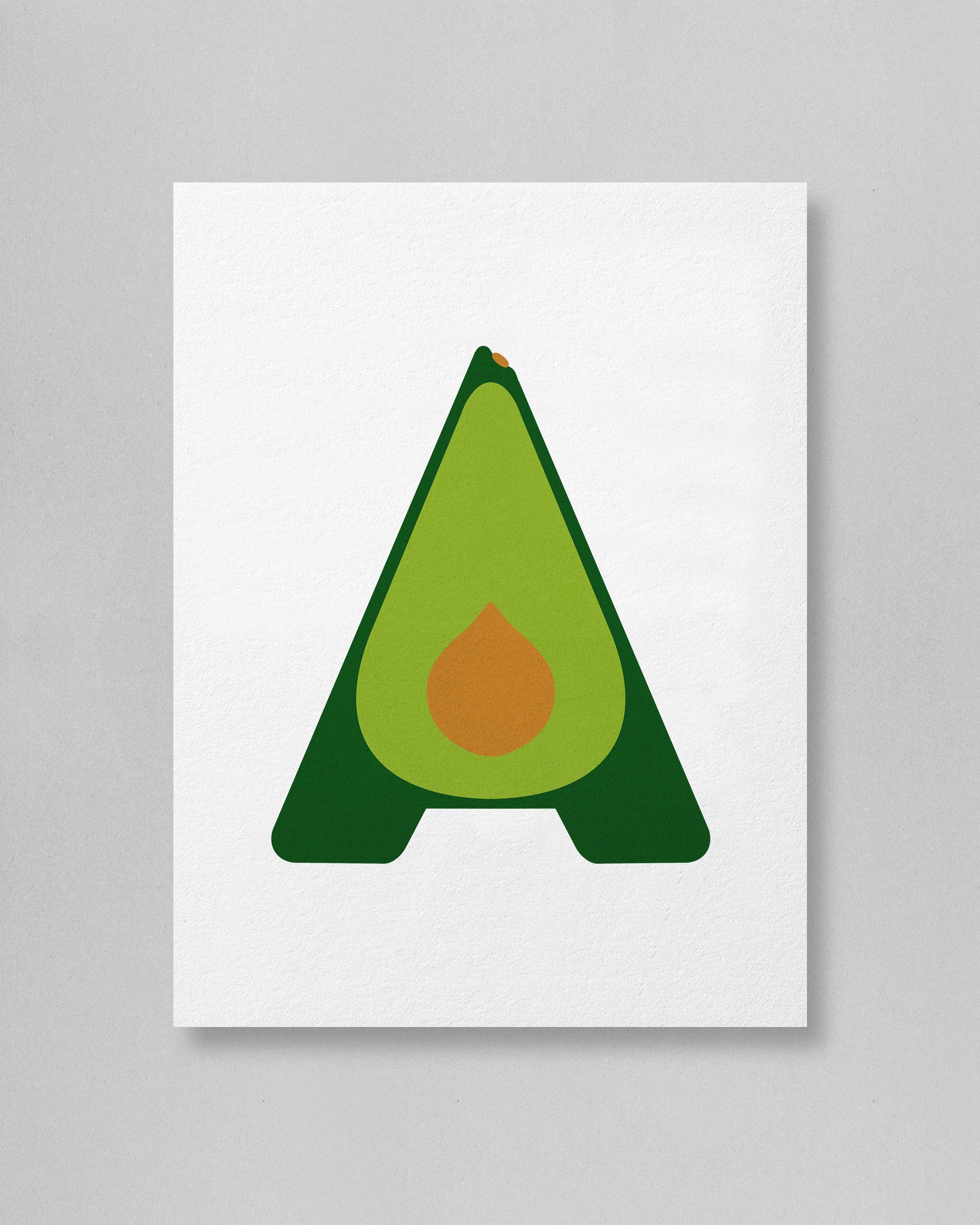Avocado-shaped letter 'A' with a green body and brown pit on a white background